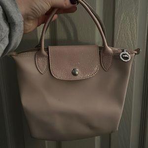 Longchamp Mini “Le Pliage” handbag in light pink